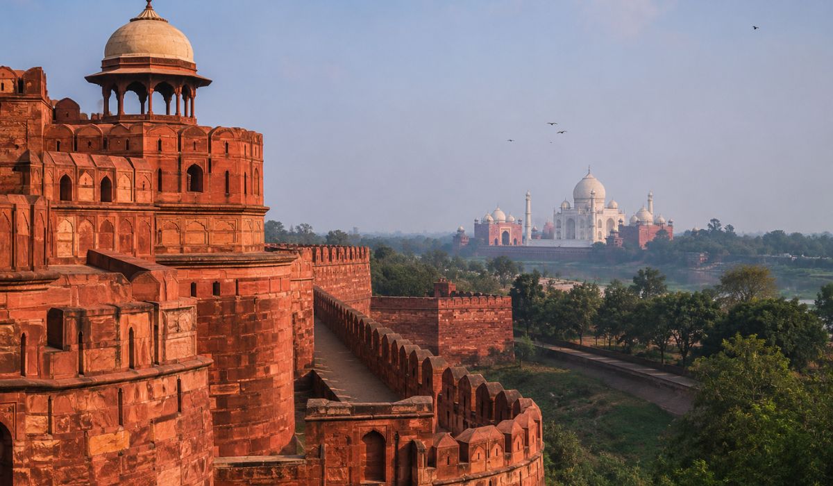 Agra Fort's red sandstone walls with the Taj Mahal visible in the distance.@Create image (2)